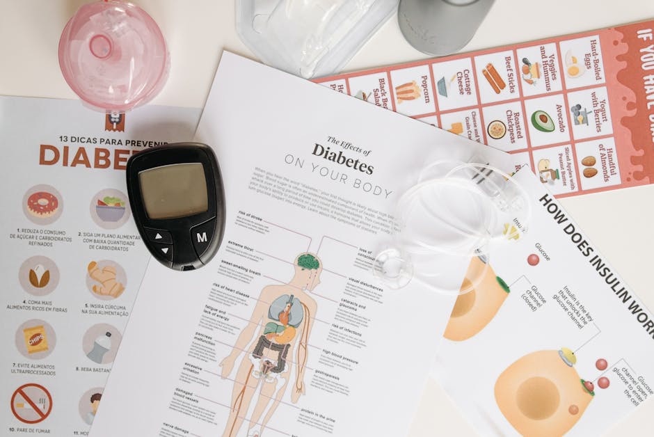 Close-up of diabetes management tools and informational documents on a table.